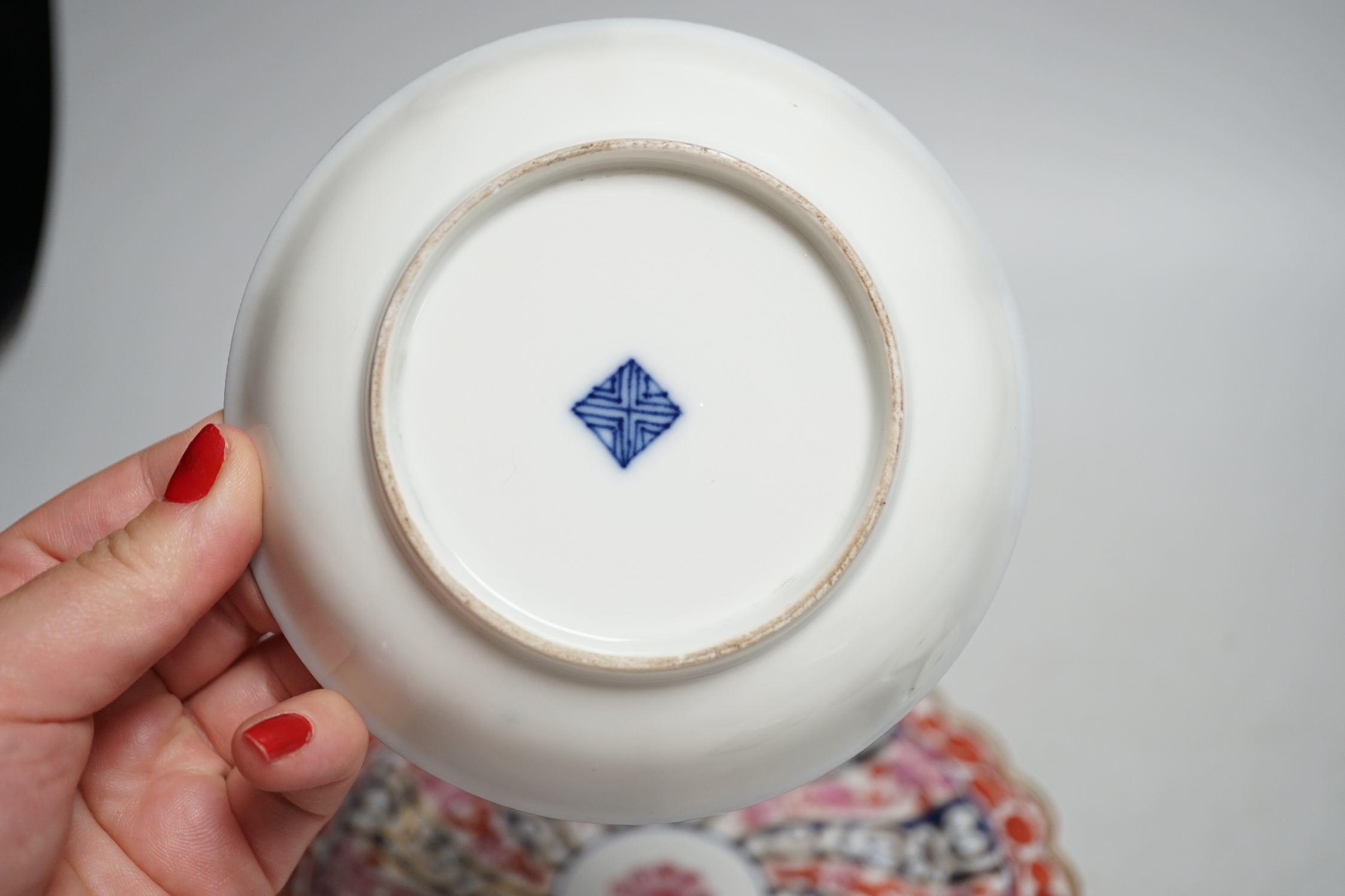 A Worcester kakiemon style scale blue trio, c.1770, a Worcester Queen Charlotte’s pattern plate, 19.5 cm and a Samson saucer in Worcester style